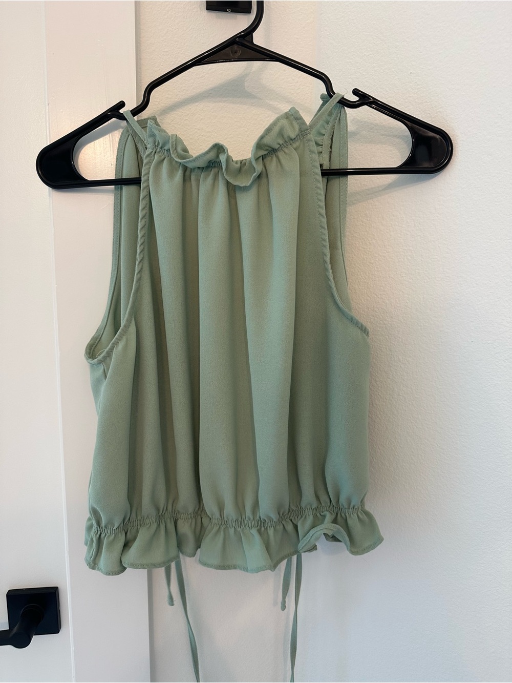 Sleeveless Ruffle-Hem Tie Back Blouse in Sage Green